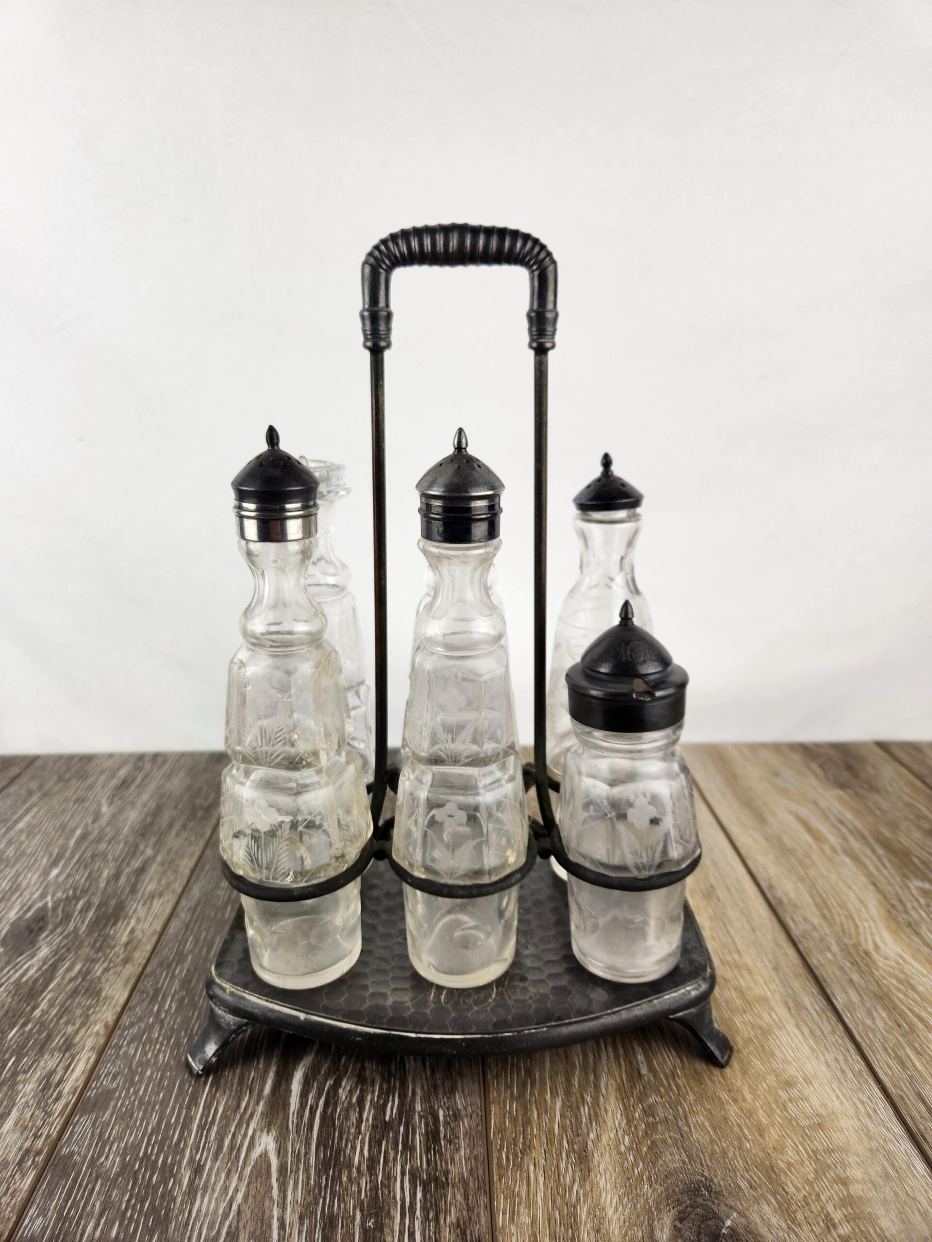 collection of matching cruets crossword